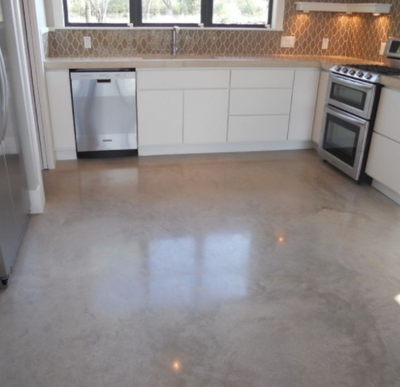 kitchen concrete polished floor with dishwasher and stove.