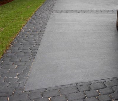 Concrete driveway with slate brick boarder.