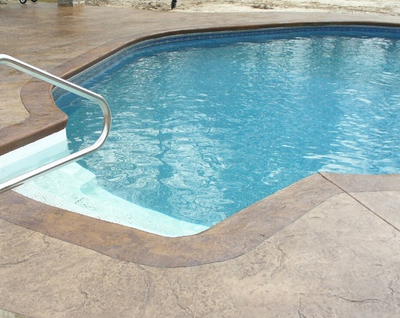 in-ground pool with stained concrete in Hartford, CT.