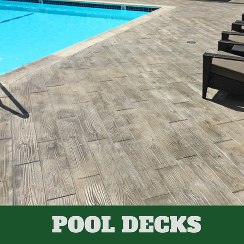 stamped concrete pool surround with a wood grain finish.
