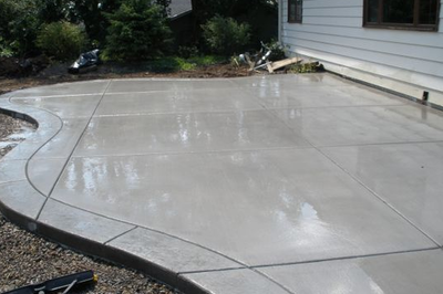 Sealed grey concrete patio.